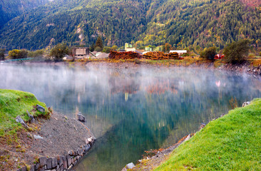 Fototapeta premium lake in the Poschiavo, Felled trees