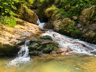 Fototapeta premium Mountain waterfall in Krasnaya Polyana, Sochi