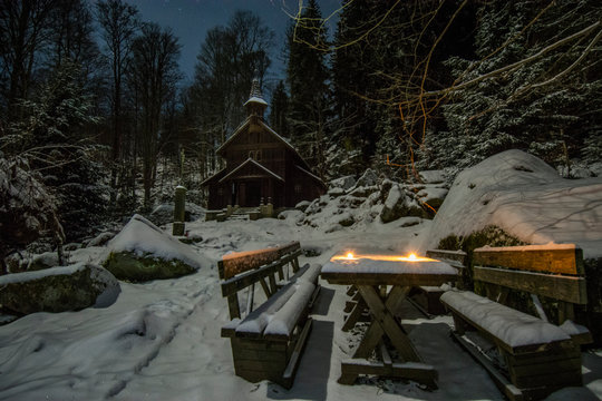 Sumava, Czech republic- February 2020: Chapel Stozec in The National park Sumava during the winter night