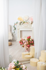 large mirror in a beautiful frame, reflection fireplace decorated with flowers