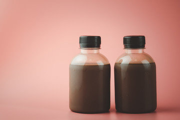 Two fresh chocolate milk in small beverage bottle