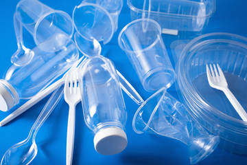 single use plastic bottles, cups, forks, spoons. concept of recycling plastic, plastic waste