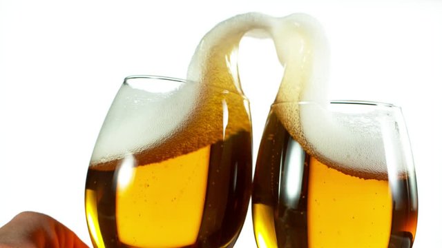 Super slow motion of two beer glasses hitting together, cheers concept. Filmed on high speed cinema camera, 1000 fps.