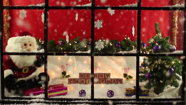 Shop window front at Christmas with display the other side of the glass. Snowing outside. Looking in. Stock Video Clip Footage