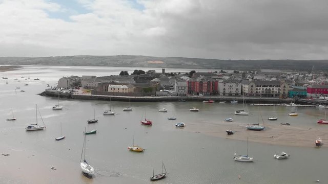 Beautiful coastal village of Dungarvan, Co Waterford,boats resting on mudplains in foreground, part of Irelands Ancient East tourist trail