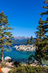 Fototapeta na wymiar Framed View of The Clear Water Of Lake Tahoe at Rocky Cove, Sand Harbor, Lake Tahoe, Nevada, USA
