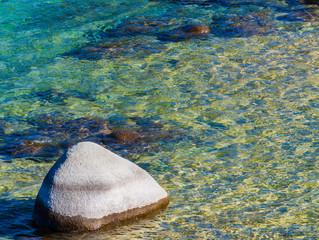 Single Boulder In The Clear Water Of Lake Tahoe at Rocky Cove, Sand Harbor, Lake Tahoe, Nevada, USA