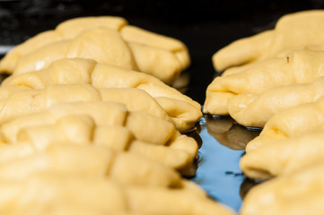 Women making dought.Dought for pizza and bread.Food