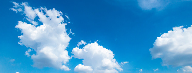 Naklejka na ściany i meble Panorama blue sky background with tiny clouds.Blue backdrop in the air. Abstract style for text.