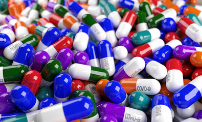 Capsules or pills with inscription COVID-19 cure on multi color surface by close up view. Concept of Virus Pandemic Protection. Coronavirus or COVID-19 concept. 3d render