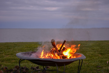 Bonfire in a waterfront backyard along the Chesapeake Bay