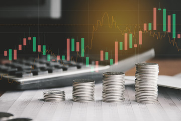 Stack of money coin with trading graph, financial investment concept can be use as background