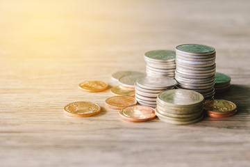 Stacks of money coin on wooden desk, Financial concept. 