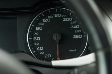 View from inside a car on a part of dashboard