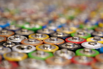 Many multicolored used batteries