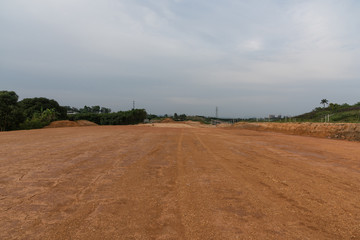 Fototapeta na wymiar Perspective view of spacious dirt subgrade horizon view