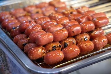 thailand street food grilled sausages on the grill