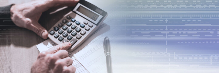 Hand using calculator, accounting concept; panoramic banner