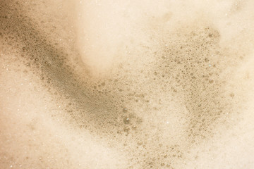 Abstract background white soapy foam texture. Shampoo foam with bubbles. foam in the bathroom background