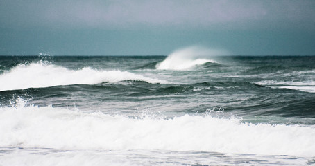 waves crashing on rocks