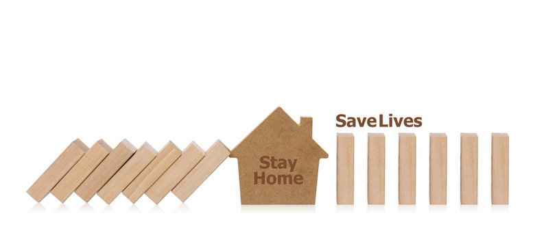 House model stopping the domino prevents the falling. Concept of how to stop the coronavirus from spreading. Stay home