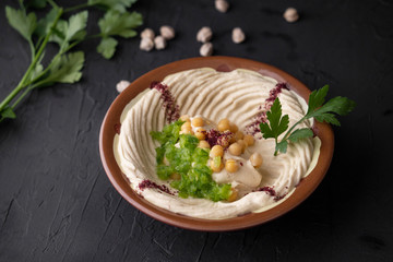 arab breakfast with hummus and falafel and fattah and foul on white wooden table Jordanian food 