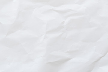Crumpled white paper texture background, top view