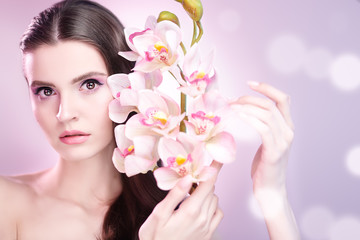 girl with orchid flowers