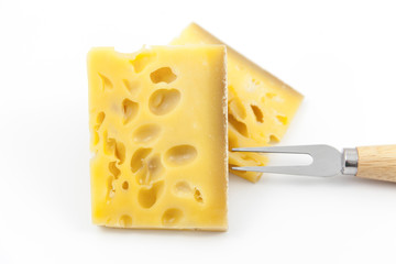 Gruyere cheese on top of a white background.