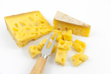 Gruyere cheese on top of a white background.