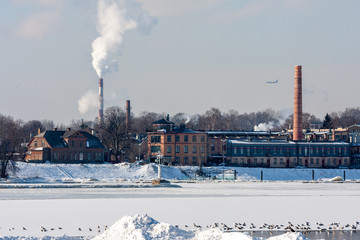 Riga, Latvia, 2011, February, Industrial brick buildings and chimneys in winter
