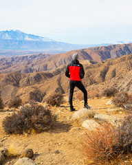 Hiker hiking in the mountains with beautiful landscape views in California