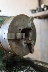 Fototapeta premium The old lathe machine is painted green.