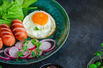 healthy breakfast, fried eggs sausages and vegetables Menu concept. food background. top view copy space for text keto or paleo diets