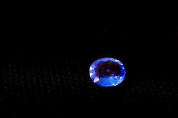 Diamonds, and colorful jewels in black and colorful background. Brilliant, expensive and precious crystal gemstone for jewelry. Closeup gem.