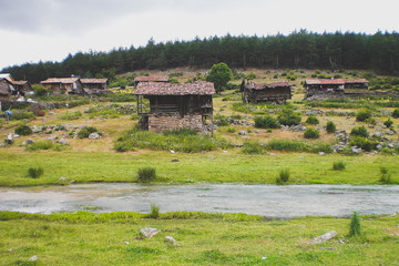 mountain houses in front of the river

