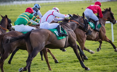 Race horses and jockeys competing for first place, horse racing action