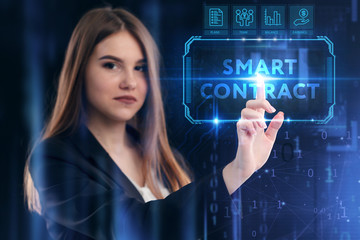 Business, Technology, Internet and network concept. Young businessman working on a virtual screen of the future and sees the inscription: Smart contract