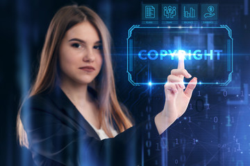 Business, Technology, Internet and network concept. Young businessman working on a virtual screen of the future and sees the inscription: Copyright