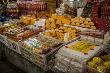 Shop selling incense, candles, Buddhist offerings.