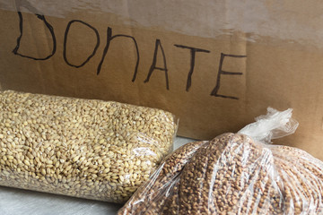 buckwheat and oat groats lie on the background of a box with inscription 