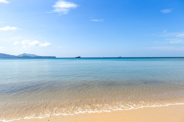 Fototapeta na wymiar Clean sea water and fine sand beach, summer outdoor day light, Phuket island in South of Thailand, holiday and vacation destination in Asia
