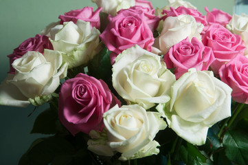 Roses posy over green background