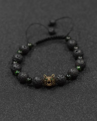 Round stone bracelets on a black background. Natural stone jewelry bracelets. bracelet made of stones.