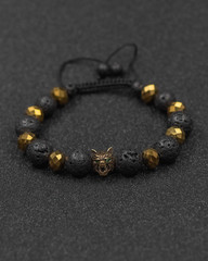 Round stone bracelets on a black background. Natural stone jewelry bracelets. bracelet made of stones.