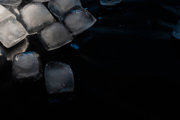 Ice cubes on a black background