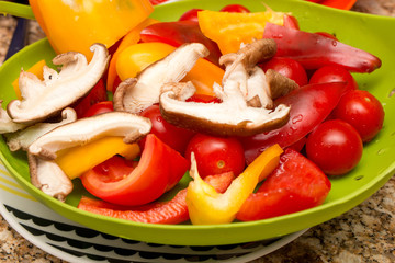 Freshly cut raw vegetables being prepared to be cooked 