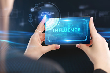 Business, Technology, Internet and network concept. Young businessman working on a virtual screen of the future and sees the inscription: Influence