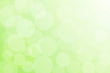 Sunny abstract green nature bokeh background. Defocused soft lights. Fresh spring garden or forest foliage in sunlight. Easter wallpaper. Springtime summer concept.