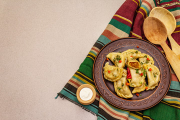 Dumplings stuffed stewed cabbage and sour cream. Traditional Ukrainian dish varenyky